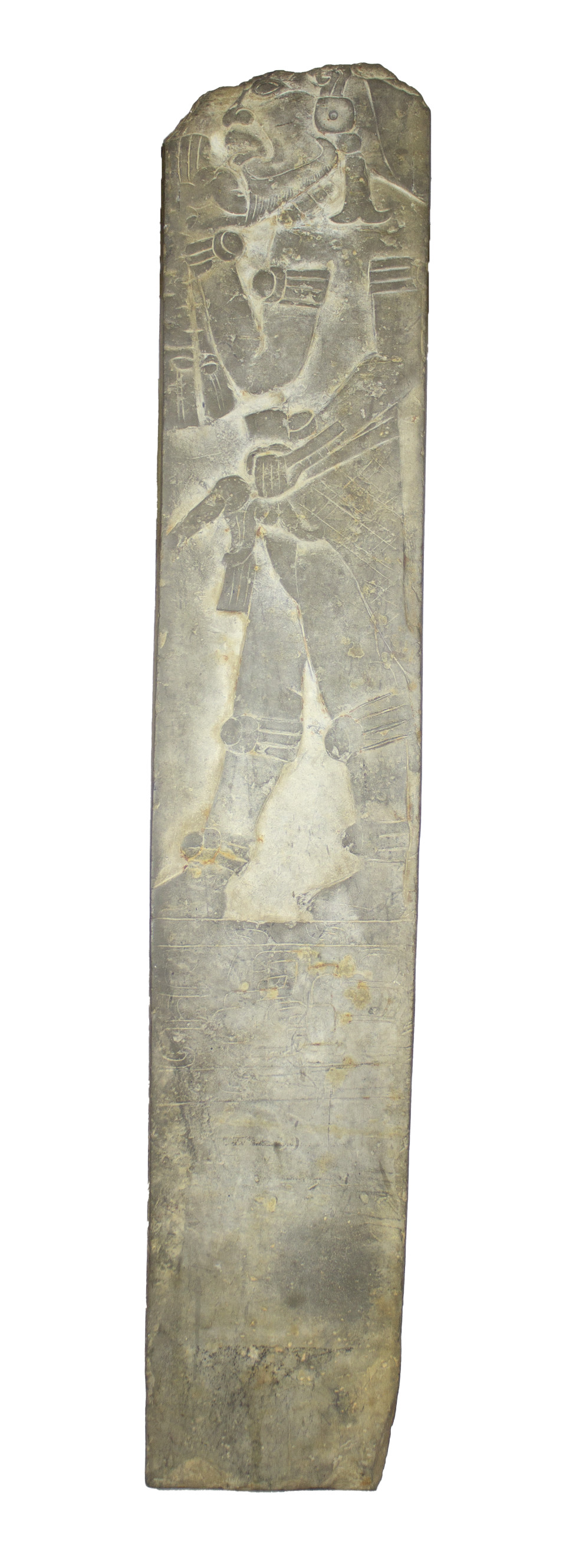 A narrow dark tan stone slab with the figurine of a man carved on the uppermost portion. Beneath his feet are lightly incised markings that blend into the worn texture.